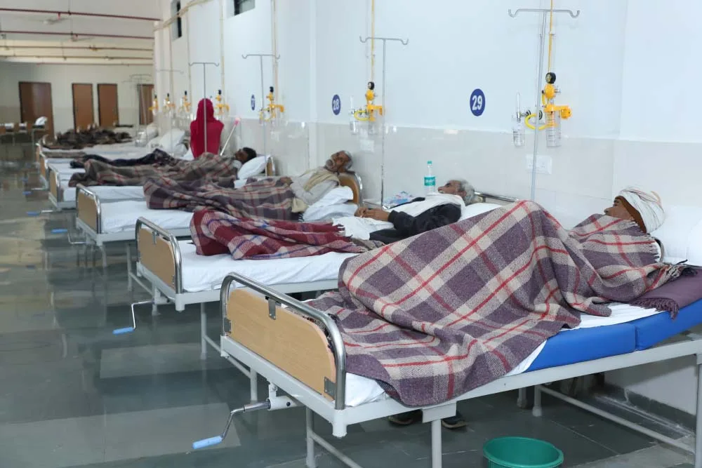 Hospital ward with a row of patient beds