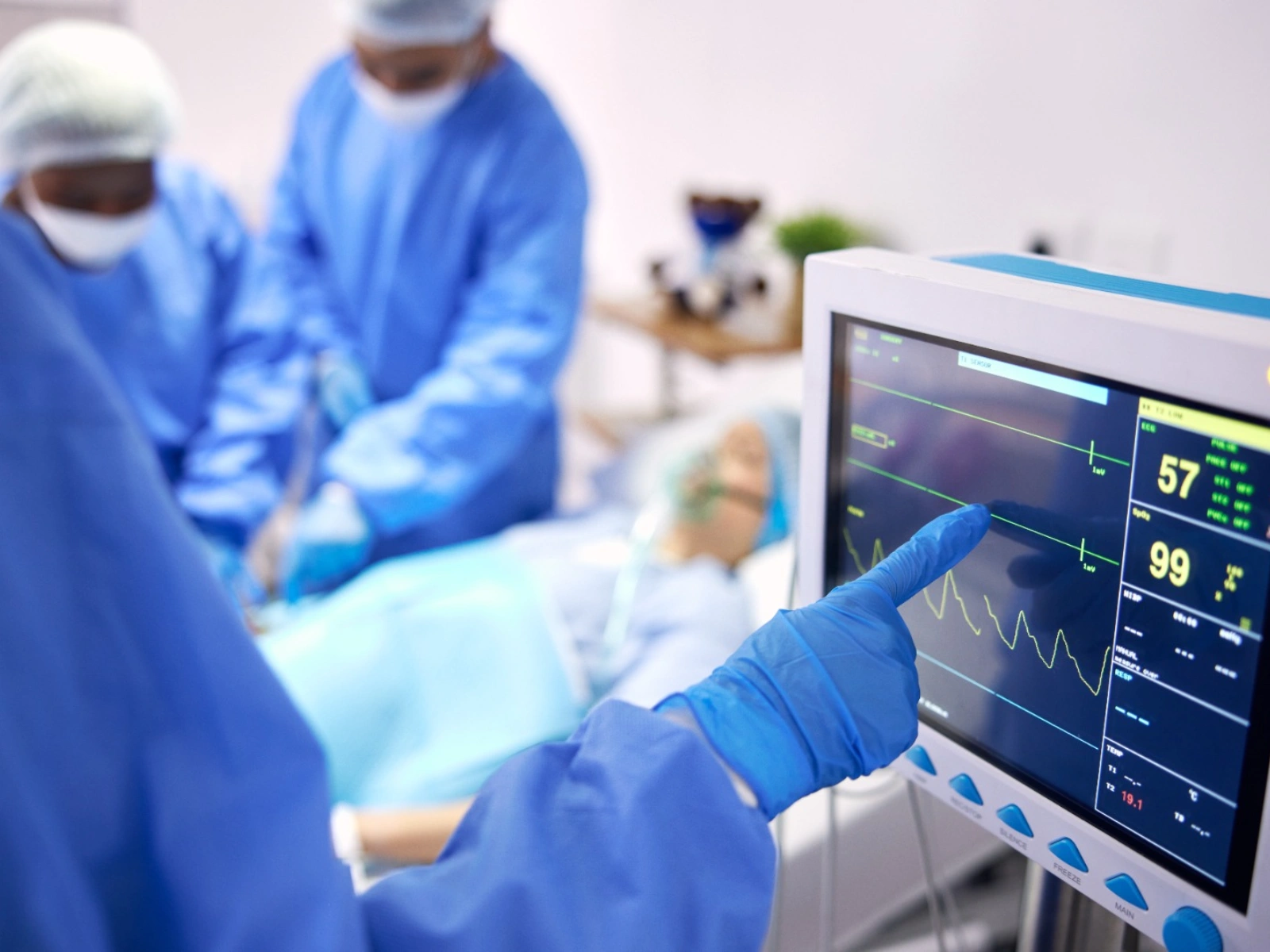 Surgical team monitoring a patient's vitals during a procedure