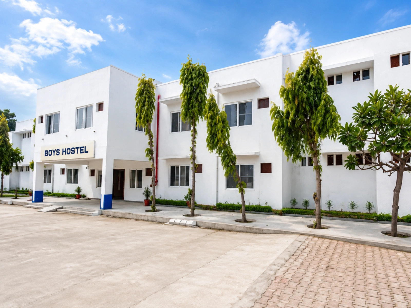 Boys Hostel building exterior with landscaped entrance